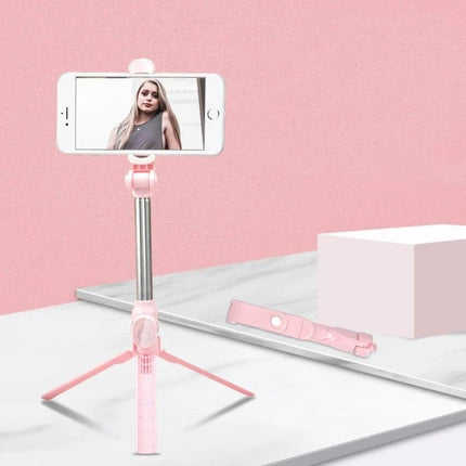 Tripod Selfie Stick for Everyday Photos and Group Shots - pink compact tripod selfie stick with smartphone mounted for hands-free group and solo photos