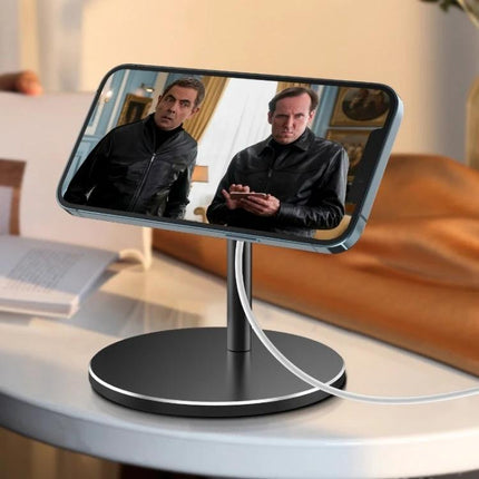 MagSafe Magnetic Wireless Charging Stand with Adjustable Angle holding a phone for video viewing on a desk, aluminum alloy base and cable management