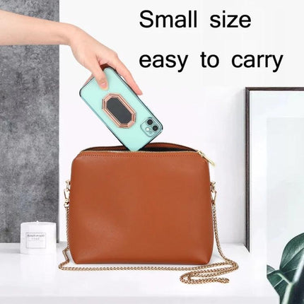Magnetic Zinc Alloy Phone Ring Holder for Cars and Daily Use - compact ring mount shown on phone being placed into handbag