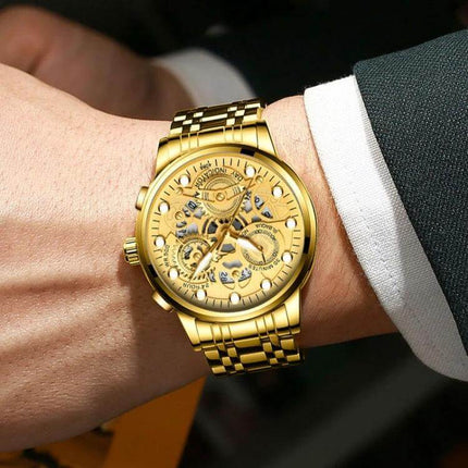 FNGEEN Men's Waterproof Luminous Quartz Watch For Daily Use gold skeleton dial on wrist, luminous hands, stainless steel bracelet, 30m waterproof