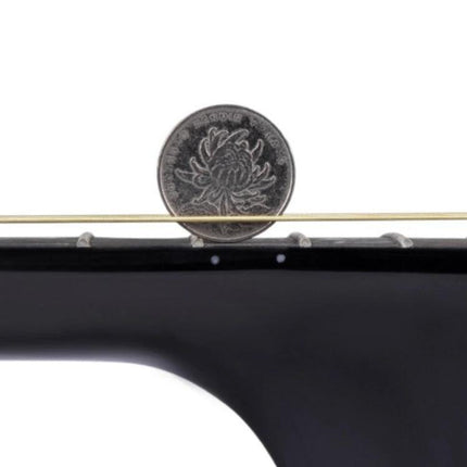 Folk Acoustic Guitar for Beginner Daily Music Practice Sessions - close-up of adjustable string height over frets with coin for scale