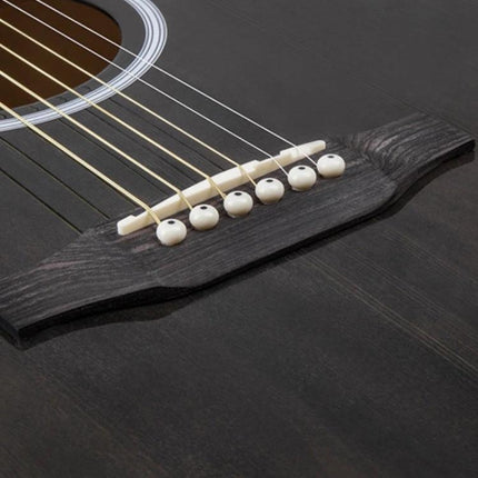 Folk Acoustic Guitar for Beginner Daily Music Practice Sessions close-up of wooden bridge, strings and saddle for practice at home