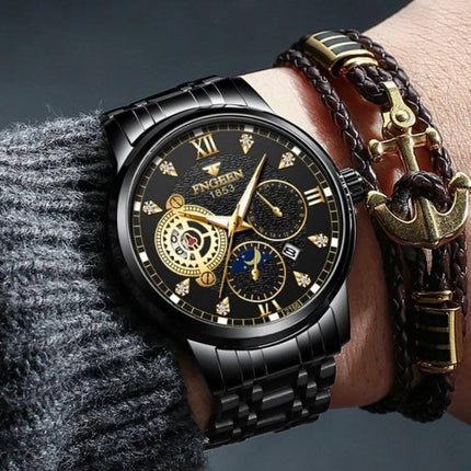FNGEEN Men's Three-Eye Quartz Watch for Everyday Wear - black and gold stainless steel wristwatch with three sub-dials and date display on wrist