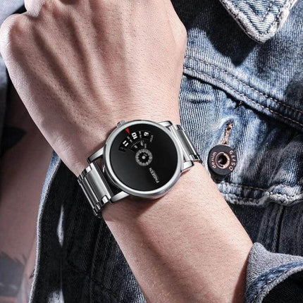 FNGEEN S230 Men's Black Steel Quartz Watch for Daily Use on wrist with black dial, stainless steel strap, date window — everyday reliable timepiece