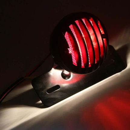 Retro Motorcycle Tail Light with Red Brake Indicator mounted on metal shell with PC lens showing red brake glow for improved visibility