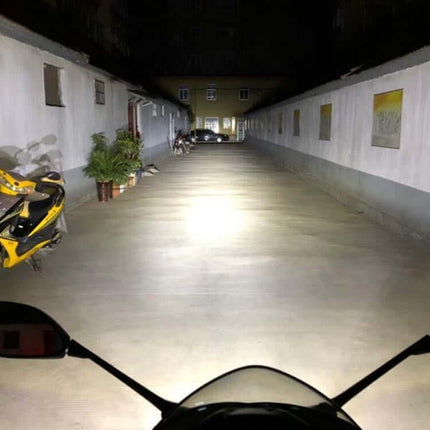 40W White LED Motorcycle Spotlight Headlight For Front Bumper And Off Road Roof shining bright beam on night driveway from motorcycle view