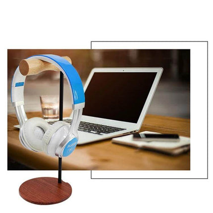 Beech Wood Headphone Stand With Metal Base For Desk on a home office desk holding over-ear headphones neatly