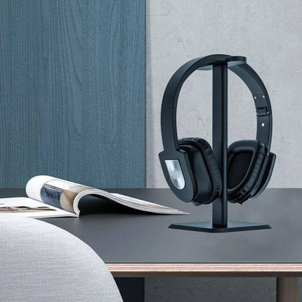 Aluminum Headphone Stand For Desk Organization And Easy Access showing black headphones upright on a desk