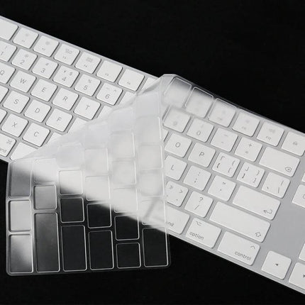 Transparent TPU Protective Film for iMac 2017 Magic Keyboard draped over white Apple Magic Keyboard to protect keys from dust and spills