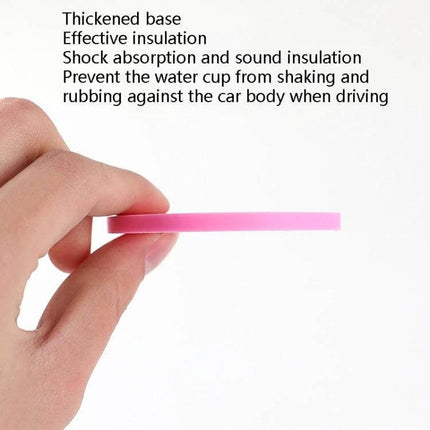 Car Diamond Honeycomb Water Coaster 7 Cm Anti Slip Mat shown thin pink PVC disc held by hand, honeycomb non-slip design, shock absorption and insulation
