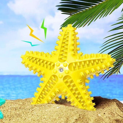 Starfish Voice Dog Toy for Everyday Play and Teeth Cleaning bright yellow spiky starfish chew toy on beach for dental care and play