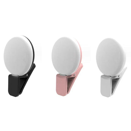 Compact LED Light for Daily Phone Photos and Social Media — three compact clip-on LED lights in black, pink, and white for phone photography
