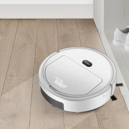 Automatic Black Sweeping Robot for Household Cleaning on light wood floor near shoe rack, compact durable plastic design navigating edges