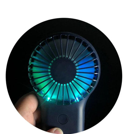 Compact Portable Handheld Mini Fan with USB Charging and LED Lights held showing glowing blue-green LED lights and front grille