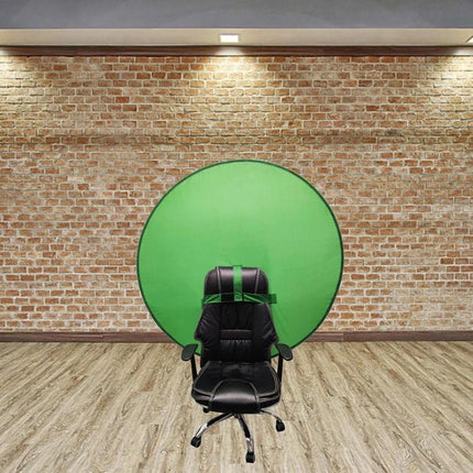 Folding Green Screen Backdrop for Photography and Video Use showing round green screen behind a black office chair in studio