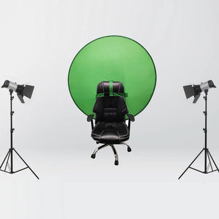 Folding Green Screen Backdrop for Photography and Video Use behind office chair with studio lights, 190 Oxford cloth, collapsible 30-50cm