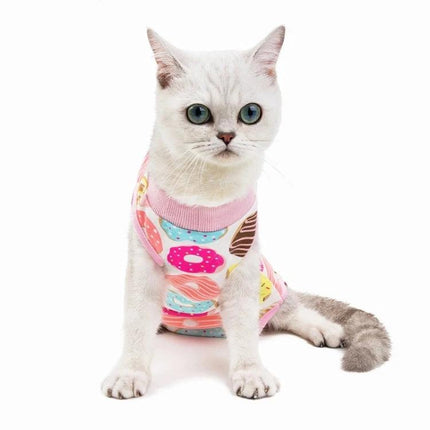 Comfortable Outfit for Cats During Home Recovery Times - white cat wearing soft cotton recovery outfit with colorful donut pattern