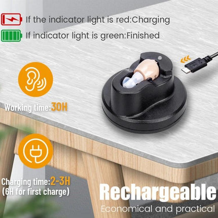 Z-12 Rechargeable In-Ear Hearing Aid with USB Cradle Charger shown in black USB cradle on tabletop with indicator light and charging cable