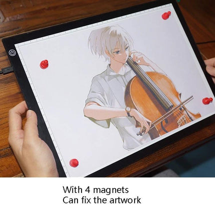 A4 Black LED Copy Board with Stepless Dimming for Drawing showing artwork secured with 4 red magnets on illuminated surface