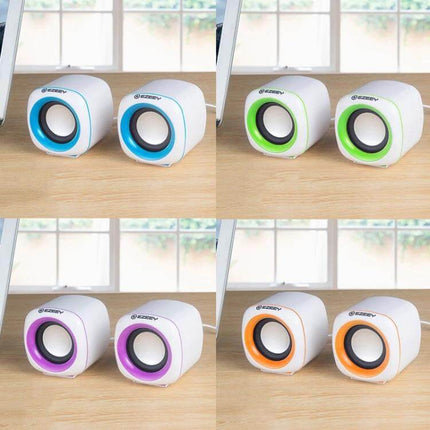 YEEZE Compact USB Desktop Speaker For Laptops And Meetings shown as four color pairs on a desk for small offices and travel