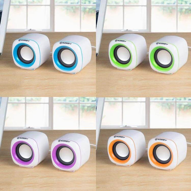 YEEZE Compact USB Desktop Speaker For Laptops And Meetings shown as four color pairs on a desk for small offices and travel
