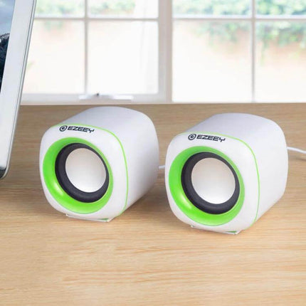 YEEZE Compact USB Desktop Speaker For Laptops And Meetings shown as compact white-green USB speakers on a laptop desk