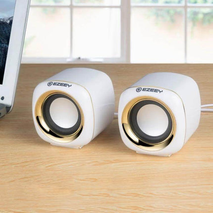 YEEZE Compact USB Desktop Speaker For Laptops And Meetings on a home desk white compact speakers for calls