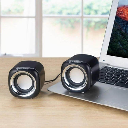 YEEZE Compact USB Desktop Speaker For Laptops And Meetings on desk beside laptop, compact 260g portable speakers for calls