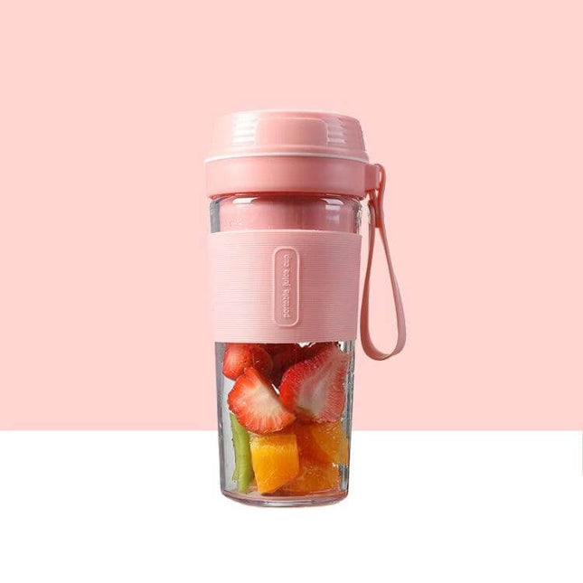 Mini Juicer Gem Blue On The Go Cup For Quick Juices - compact 270ml portable juicer cup shown in pink with fruit for travel, USB rechargeable, lightweight plastic