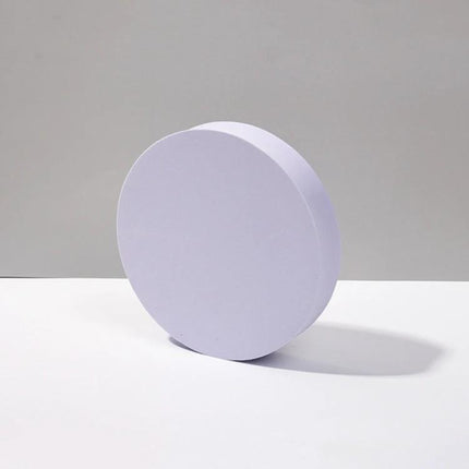 Geometric White Cube Photo Props Set for Photography Sessions showing a round white polymer foam prop used for product photography