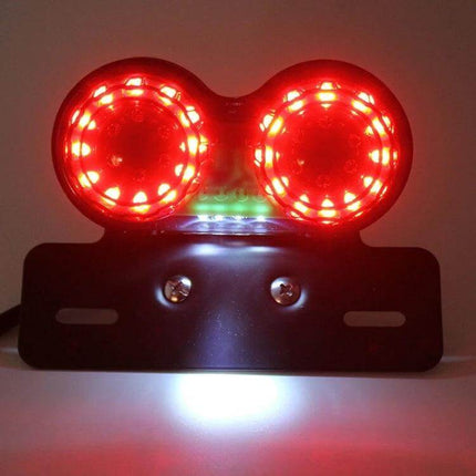 Motorcycle LED Integrated Tail Light With Brake And License Plate showing dual circular red LEDs, brake and plate illumination on black mount