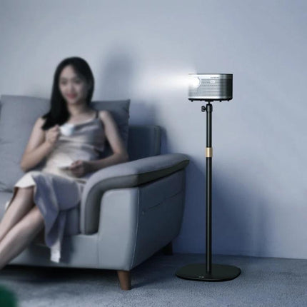 Xiaotian Liftable Telescopic Projection Bracket for Desktops holding a micro projector beside a sofa for home movie nights