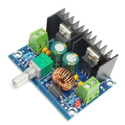 Adjustable DC-DC Buck Converter for Voltage Regulation Projects XL4016 module with heatsink, potentiometer, inductors and capacitors for DIY electronics