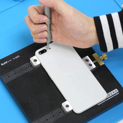 Kaisi Demolishing Pen for Safe Smartphone Camera Lens Removal being used to remove a rear camera glass on a smartphone in a repair jig