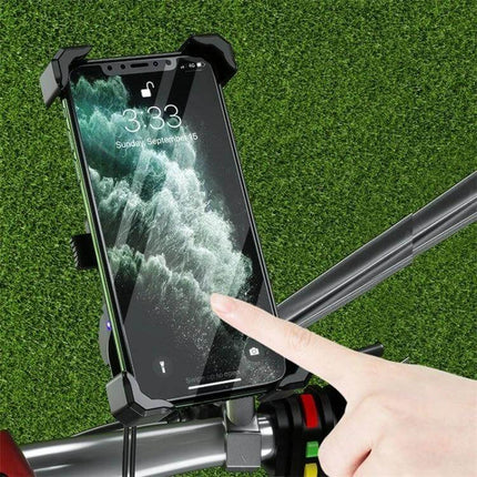 Kewig Four-Claw Motorcycle Phone Mount for On the Go Rides secured on handlebars with four-jaw clamp and silicone pads, rider touching phone screen