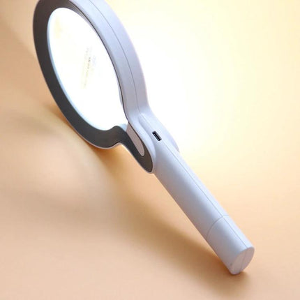 Hand-Held Magnifying Glass with LED Lights for Reading and Elderly Use showing white LED-lit lens and ergonomic handle for detailed tasks