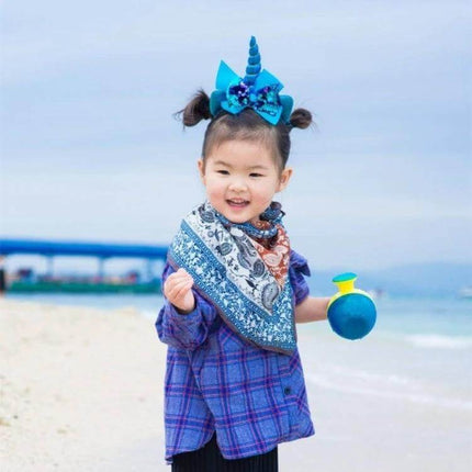 Kids Cartoon Headbands 2-Pack For Everyday Dress Up — sequined unicorn headband on smiling toddler at the beach, cotton-lined comfort