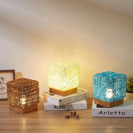 Add a Decorative Sepak Takraw Lamp to Your Bedroom Nightstand - cube hemp rope lamps on wooden bases with warm USB lighting