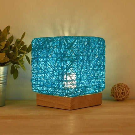 Add a Decorative Sepak Takraw Lamp to Your Bedroom Nightstand - blue woven ball lamp on solid wood base with USB light