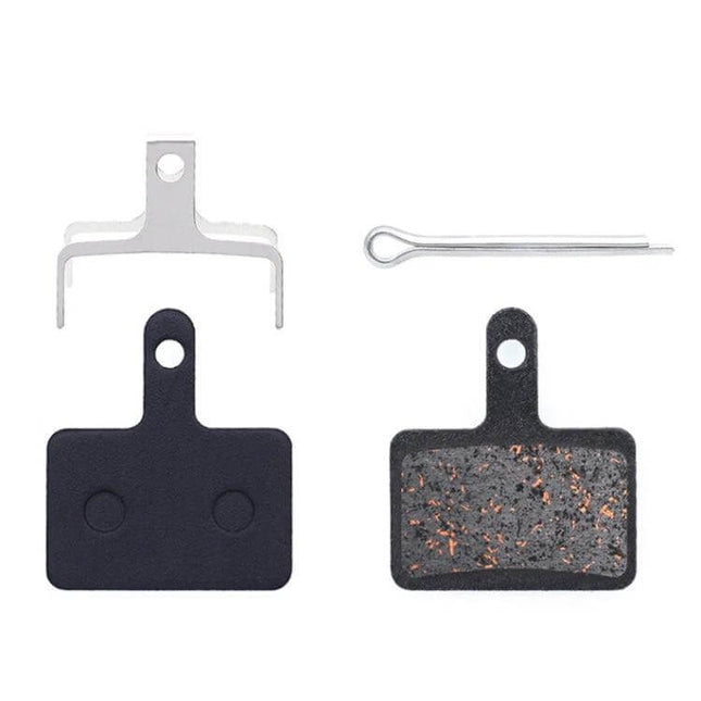 Mountain Bike Semi-Metallic Brake Pads for Disc Brakes - copper-fiber pads with steel back plate and spring clip, set for bicycle disc brakes