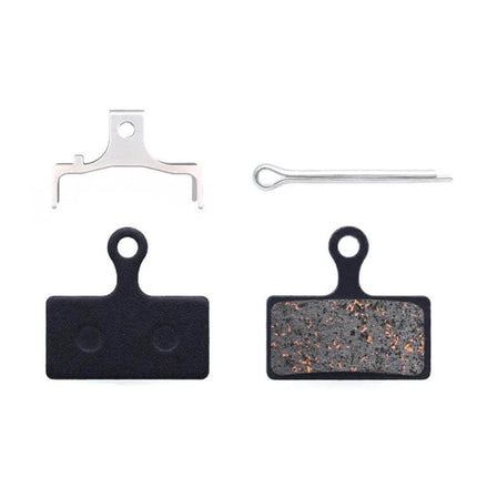 Mountain Bike Semi-Metallic Brake Pads for Disc Brakes shown with copper-fiber pad, steel back plate, spring clip and retaining pin