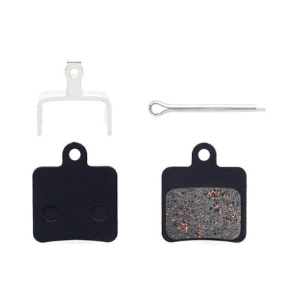 Mountain Bike Semi-Metallic Brake Pads for Disc Brakes showing two pads, copper-fiber compound surface, steel back plates and installation spring