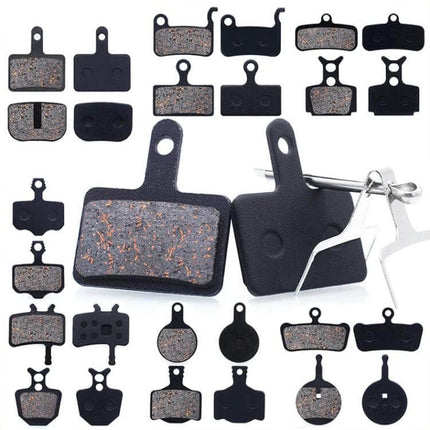 Mountain Bike Semi-Metallic Brake Pads for Disc Brakes close-up showing copper-fiber pads with steel back plates and spring clip