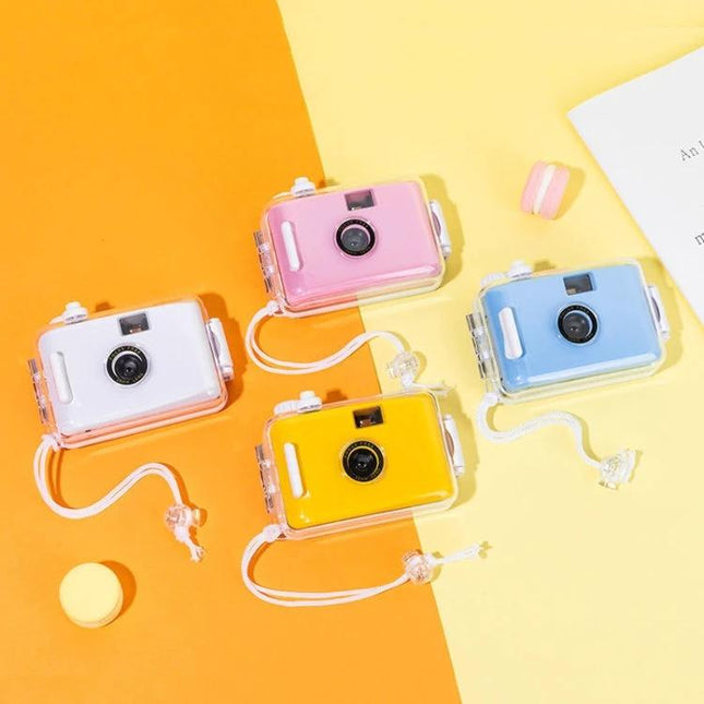 Vintage Waterproof Film Camera for Outdoor Photography Use - colorful waterproof 135 film cameras (pink, blue, yellow, white) on orange and yellow background
