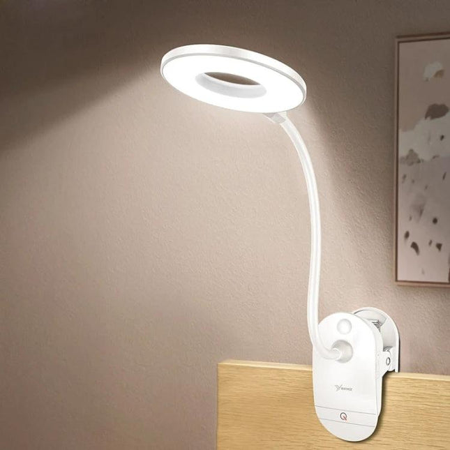 YAGE Clip Lamp for Everyday Home and Office Reading clipped to desk edge with flexible gooseneck and bright ring light for focused reading