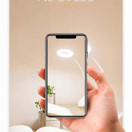 YAGE Clip Lamp for Everyday Home and Office Reading - hand holding phone showing lamp over open book with no strobe lighting