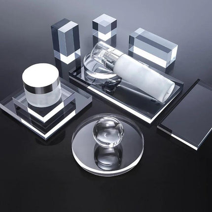 Acrylic Geometric Photo Props for Studio Backgrounds and Ornaments arranged with skincare bottle and jars on reflective black surface
