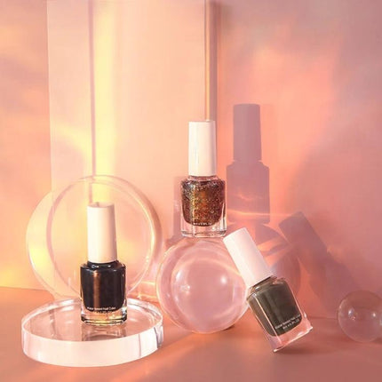 Acrylic Geometric Photo Props for Studio Backgrounds and Ornaments showcasing clear acrylic shapes arranged with nail polish bottles for depth and composition