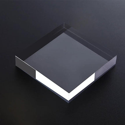 Acrylic Geometric Photo Props for Studio Backgrounds and Ornaments - clear square acrylic prop on black surface to add depth in product photography