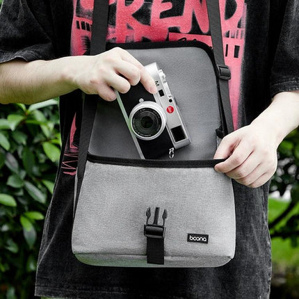 Baona Waterproof Camera Shoulder Bag for Everyday Use - grey Oxford cloth camera bag with front pocket holding a camera